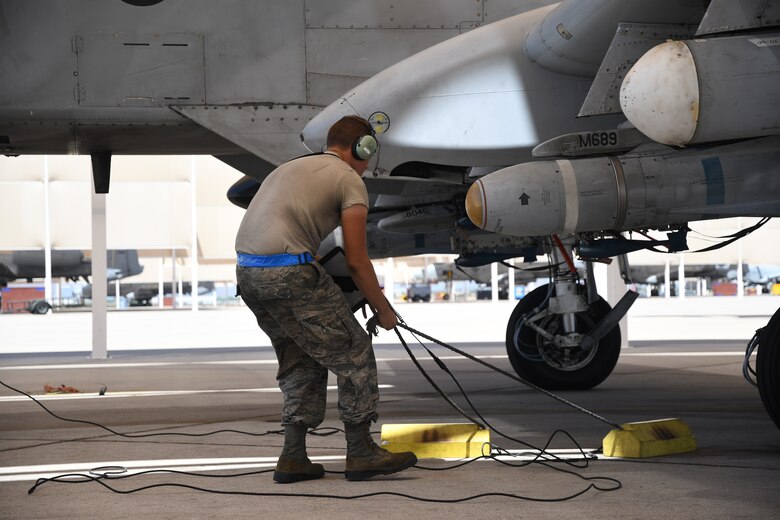 a photo of an airman pulling chalks