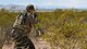 a simulated enemy looking for Air Force rescue troops in the desert