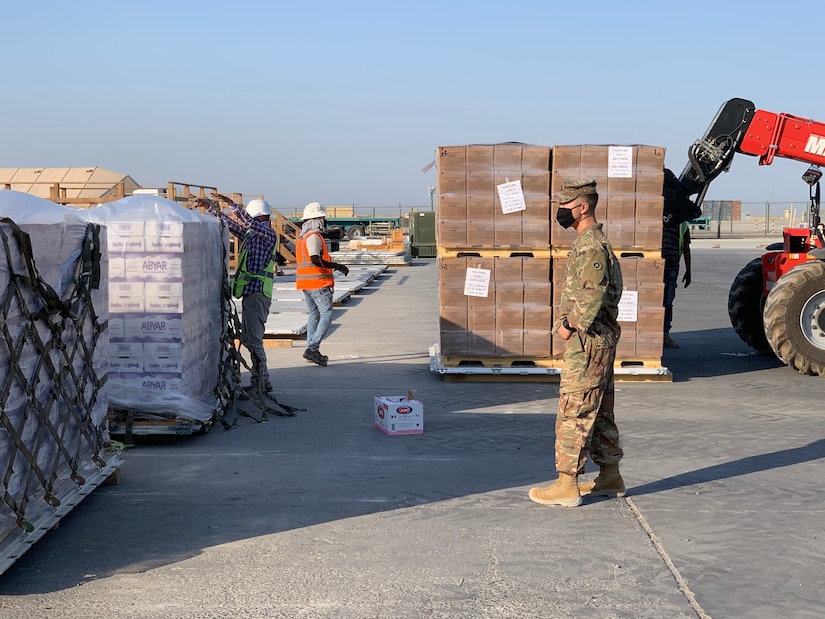 In response to the tragedy in Lebanon, 1st. Lt. Morgan Kim, distribution integration branch operations officer, 1st Theater Sustainment Command, ensures supplies are ready for transport at Camp Arifjan, Kuwait, Aug. 5, 2020. In less than 24 hours, the 1st TSC packaged and shipped more than 21,000 cases of culturally appropriate meals, 5,700 cases of bottled water, 670 cases of health and comfort packs, and three pallets of medical supplies.