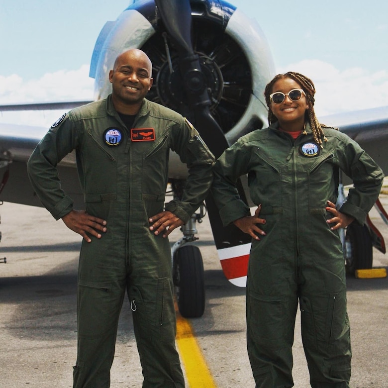 Maj. Kenneth Thomas, a navigator with the 94th Airlift Wing, Dobbins Air Reserve Base, Georgia, and his daughter, Dominica Thomas, after flying a historic T-28 Trojan Warbird in 2020.