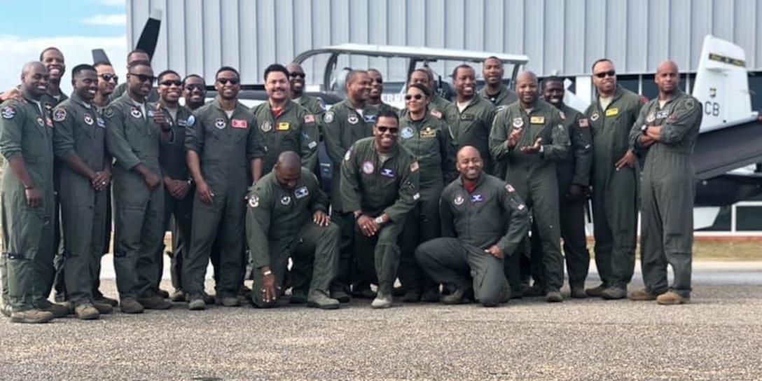 A group photo of a Legacy Flight Academy's Eyes Above the Horizon event at Moton Field in Tuskegee, Alabama in 2019.