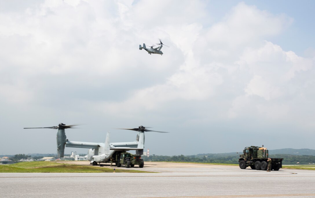 U.S. Marines with 3d Marine Expeditionary Brigade load gear onto an MV-22B Osprey with Marine Medium Tiltrotor Squadron 265, 1st Marine Aircraft Wing, during a flyaway drill on the flight line of Kadena Air Base, Okinawa, Japan, Aug. 18, 2020. The MEB continues to conduct essential, realistic training while adhering to strict COVID-19 safety protocols to mitigate the spread of COVID-19 and are prepared to deploy in support of our allies and partners throughout the region. 3d MEB is structured to rapidly respond to crisis around the globe immediately, effectively, and efficiently, whether they are humanitarian or combat-related.  (U.S. Marine Corps photo by Lance Cpl. Hannah Hall)