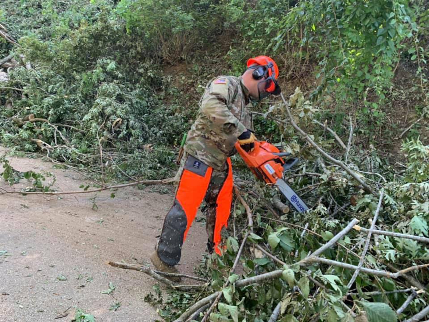 Iowa National Guard Soldiers with the 831st Engineer Company
worked Aug. 15-16, 2020, to clear downed trees to reach a substation that supplies power to parts of Cedar Rapids. An Aug. 10 derecho caused widespread damage in the area.