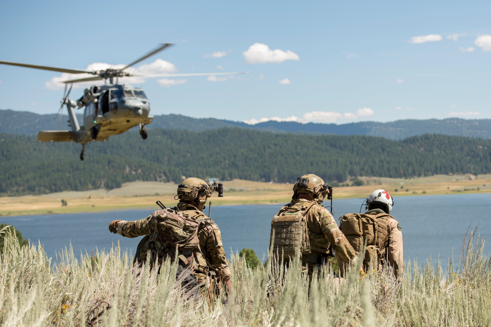 Idaho Air National Guard special warfare tactical air control party Airmen from the 124th Air Support Operations Squadron conduct search and rescue training with the IDANG 190th Fighter Squadron and the U.S. Navy’s Helicopter Sea Combat Squadron Four from North Island Naval Air Station, California, on Lake Cascade in Cascade, Idaho, August 11, 2020. The training simulated a combat search and rescue including two A-10 Thunderbolt II’s and a HSC-4 MH-60S Seahawk helicopter. (U.S. Air National Guard photo by Senior Airman Mercedee Wilds)