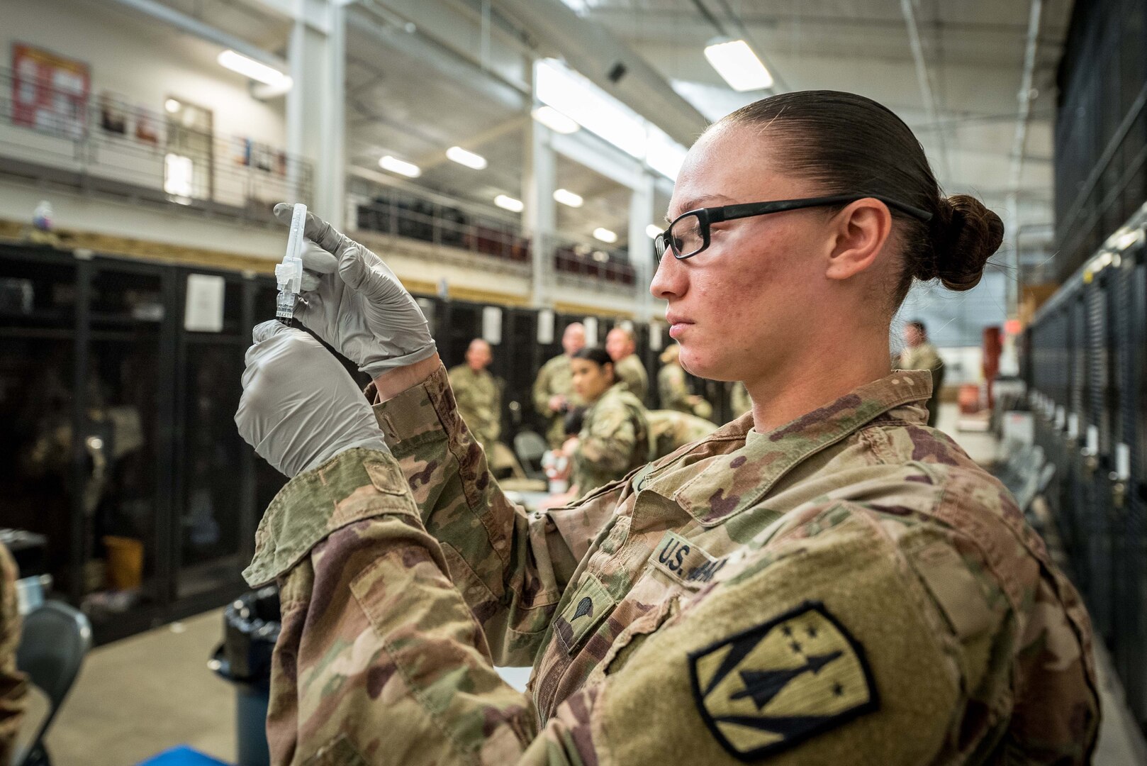 Spc. Selena M. Castillo prepares to administer a flu vaccination on Fort Sill, Oklahoma, Nov. 15, 2019. Castillo is a medic for 3rd Battalion, 2nd Air Defense Artillery Regiment, 31st Air Defense Artillery Brigade.