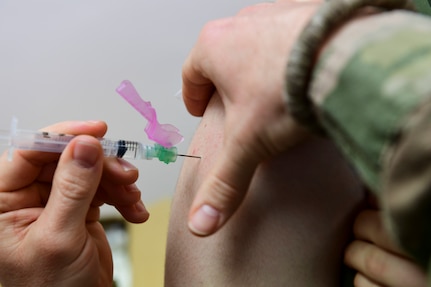 A Marine assigned to the Military Police Company B, 4th Law Enforcement Batallion recieves a vaccination at the U.S. Marine Corps Reserve Center in North Versailles, Pennsylvania,.