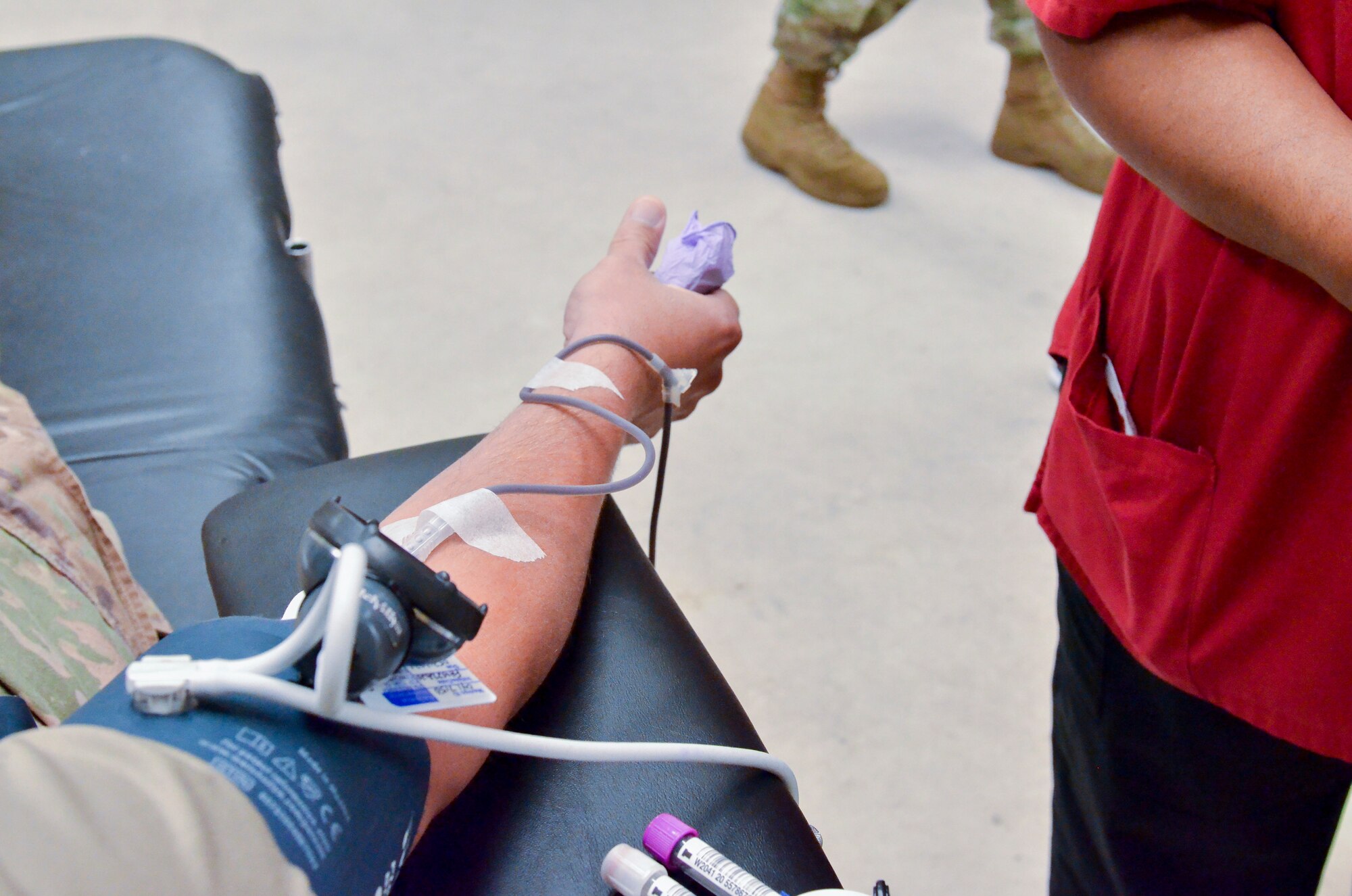 Members of the 117th Air Refueling Wing participate in a blood drive on Aug. 14, 2020 at Sumpter Smith JNGB, Ala. 
The donated blood went to local blood banks and will be used for conventional purposes like blood transfusions but extra vials of blood were taken to test for COVID-19 antibodies. Angelita Robinson, collection specialist II for the American Red Cross, explained that she’s done thousands of blood drives in her 20 years with AMCROSS but testing for COVID-19 antibodies is a new step they have added.
	“It's to check to see if a donor has the antibody,” Robinson said. “If a donor recovered from the Coronavirus they would have antibodies still in their blood systems.” 
According to Robinson, having the antibodies in the bloodstream doesn’t mean a person currently has COVID-19. 
“Any time a person has an illness or condition certain antibodies are built up in the blood,” she said. “A person who does have the antibodies will be wanted to donate plasma so they can develop some kind of vaccine.” 
A donated unit of blood will be put in extra vials that go to a lab. Tests are conducted in labs using a plasma process for the antibodies which can be used in a vaccine. Even without testing of antibodies donated blood can help save a life.
“We still need blood for patients that are in the hospital like accident victims or people who need transfusions for surgeries,” Robinson said.