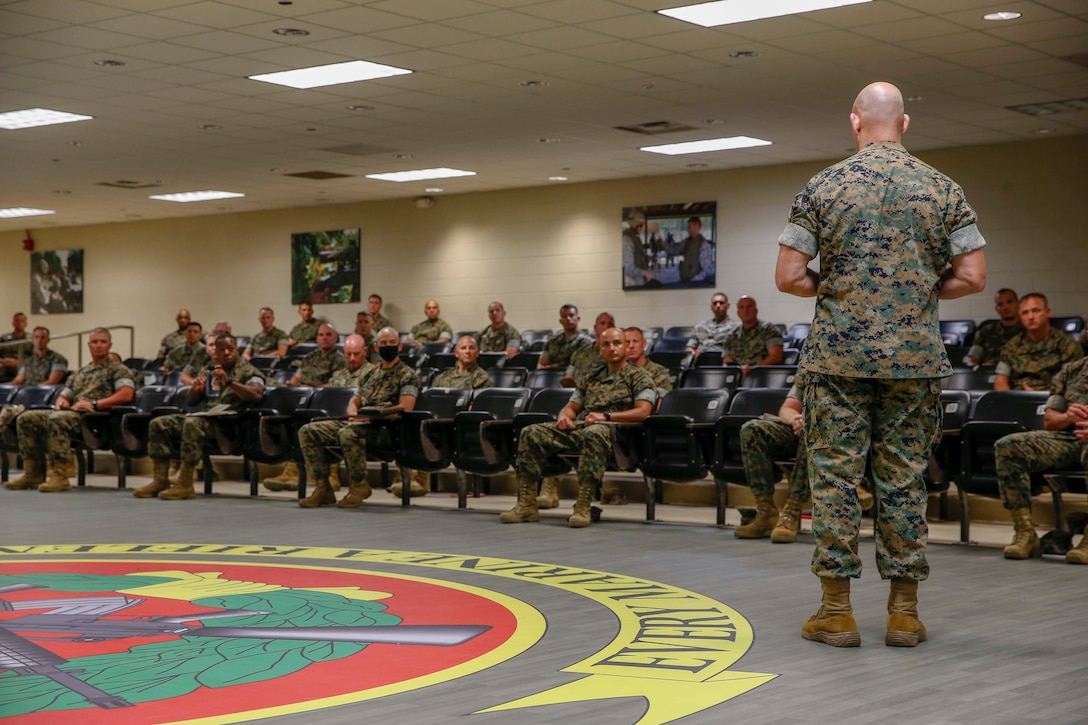 The 19th Sergeant Major of the Marine Corps, Sgt. Maj. Troy E. Black addresses Staff Non-Commissioned Officers with School of Infantry East (SOI-E) at Camp Geiger, N.C., July 23, 2020. SOI-E has implemented micro-mobile learning into their teaching methods to make resources more available to students and to tailor education to the student. The trip to North Carolina was the first of its kind since the start of the COVID-19 pandemic and allowed Sgt. Maj. Black the opportunity to visit Marines and Sailors. (U.S. Marine Corps photo by Sgt. Victoria Ross)