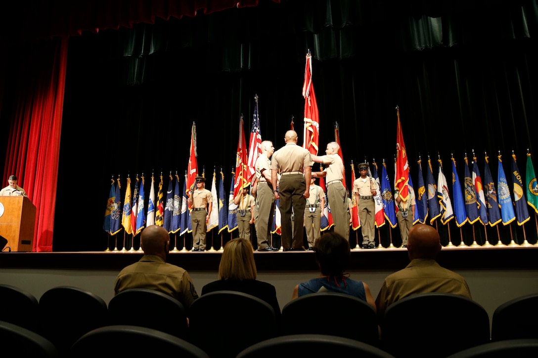 The 19th Sergeant Major of the Marine Corps, Sgt. Maj. Troy E. Black attends the Training and Education Command (TECOM) change of command ceremony as Maj. Gen. William Mullen transfers the colors to Lt. Gen. Lewis Craparotta at Marine Corps Base Quantico, Quantico, V.A., Aug. 3, 2020. The change of command transitioned TECOM for a two-star command to a three-star command. The change supports the Commandant’s Planning Guidance, as Gen. Berger’s intent to change the Service Level Training and Education from an Industrial Age model to an Information age model to better serve Marines and units for future operating environments. (U.S. Marine Corps photo by Sgt. Victoria Ross)