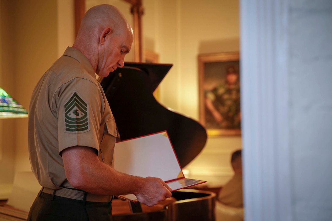 The 19th Sergeant Major of the Marine Corps, Sgt. Maj. Troy E. Black reads  Maj. Gen. David A. Ottignon’s appointment to Lieutenant General and assumption of the office of Deputy Commandant for Manpower and Reserve Affairs (M&RA) at Marine Barracks Washington, Washington D.C., Aug. 4 2020. The appointment transferred the authorities from Lt. Gen. Michael A. Rocco to Lt. Gen. Ottignon. The M&RA Department assists the Commandant by planning, directing, coordinating, and supervising both active and reserve forces. (U.S. Marine Corps photo by Sgt. Victoria Ross)