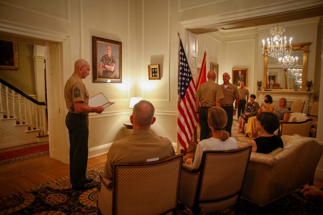 The 19th Sergeant Major of the Marine Corps, Sgt. Maj. Troy E. Black reads Maj. Gen. David A. Ottignon’s appointment to Lieutenant General and assumption of the office of Deputy Commandant for Manpower and Reserve Affairs (M&RA) at Marine Barracks Washington, Washington D.C., Aug. 4 2020. The appointment transferred the authorities from Lt. Gen. Michael A. Rocco to Lt. Gen. Ottignon. The M&RA Department assists the Commandant by planning, directing, coordinating, and supervising both active and reserve forces. (U.S. Marine Corps photo by Sgt. Victoria Ross)