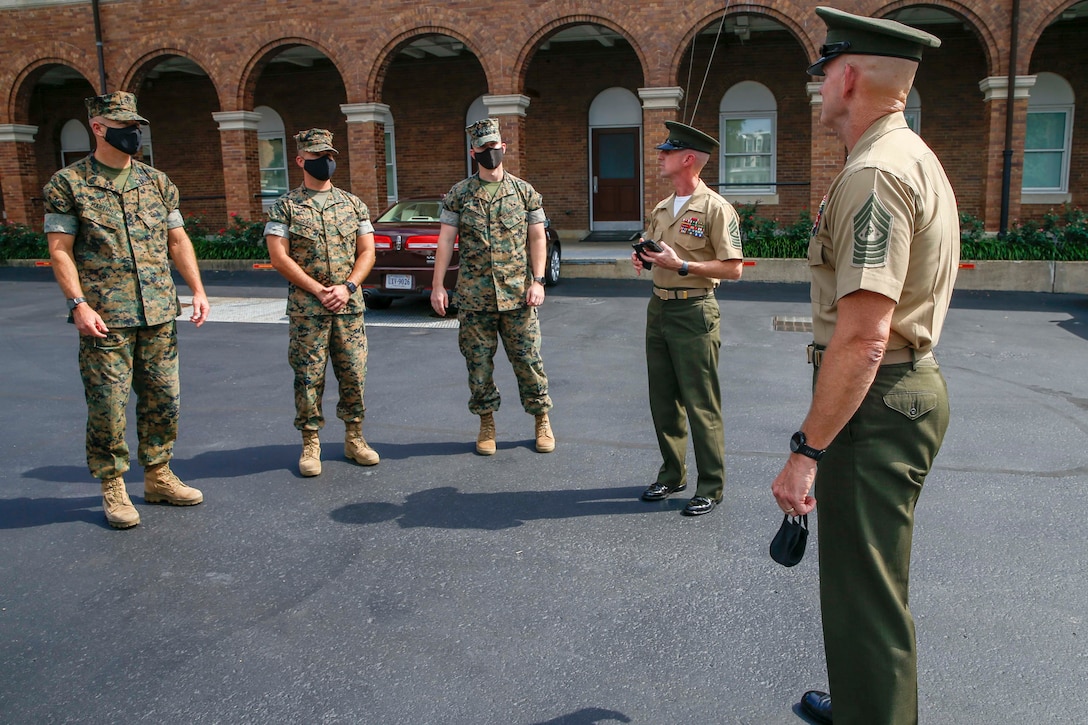 The 19th Sergeant Major of the Marine Corps, Sgt. Maj. Troy E. Black, addresses Marines from The Commandant’s Own Drum and Bugle Corps at Marine Barracks Washington, D.C., Aug. 5, 2020. The Marine was presented a coin for outstanding performance and discipline. The Drum and Bugle Corps provides music for the Commandant and Barracks commander. (U.S. Marine Corps photo by Sgt. Victoria Ross)