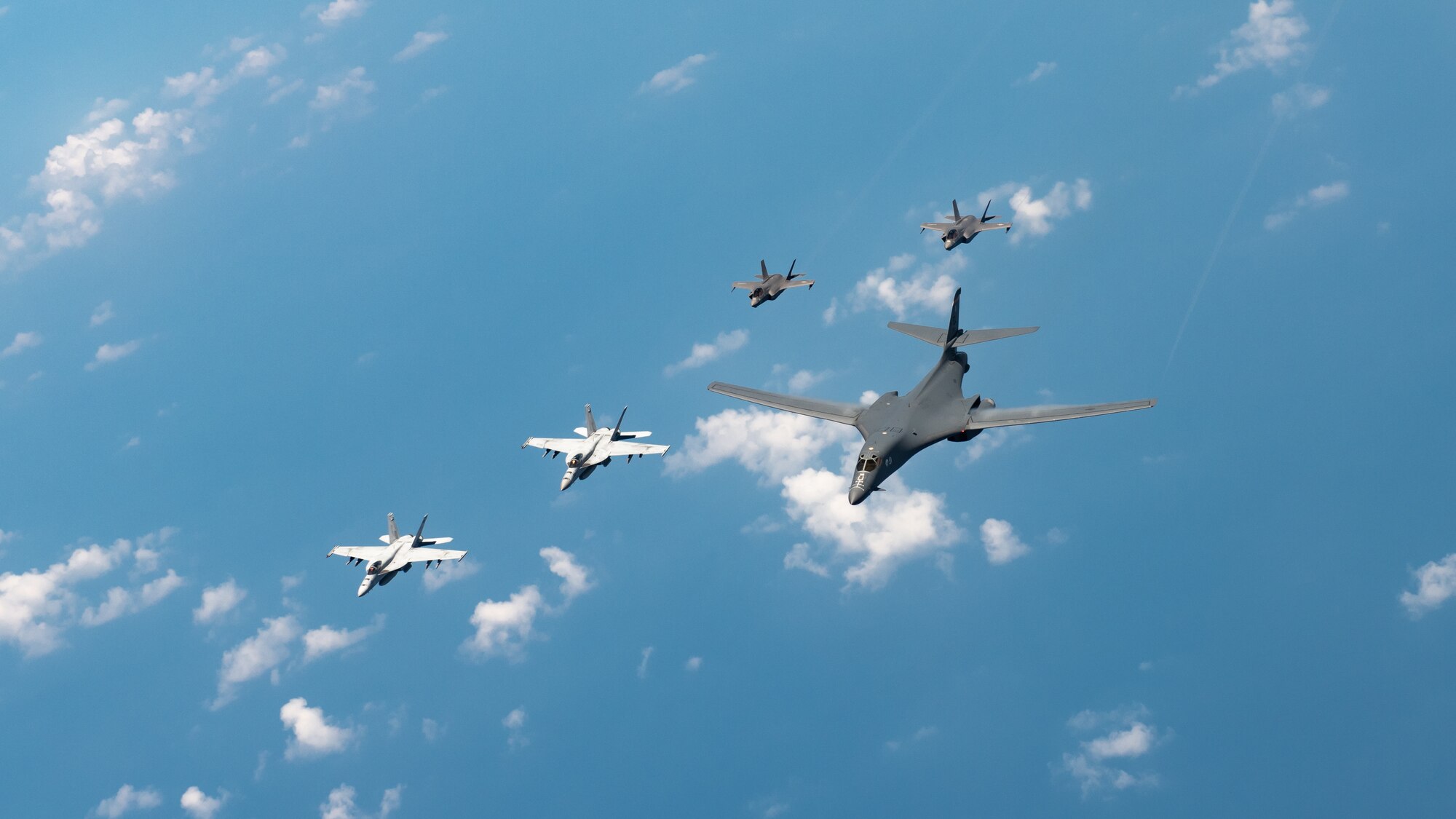 U.S. Navy Carrier Air Wing five F/A-18 Super Hornets, Marine Corps Marine Fighter Attack Squadron 121 F-35 Lightning IIs, all assigned to Marine Corps Air Station Iwakuni, Japan, and a U.S. Air Force 37th Bomb Squadron B-1B Lancer assigned to Ellsworth Air Force Base, S.D., conduct a large-scale joint and bilateral integration training exercise Aug. 18, 2020. Four B-1B Lancers, two B-2 Spirit Stealth Bombers, and four F-15C Eagles conducted Bomber Task Force missions simultaneously within the Indo-Pacific region over the course of 24 hours. Pacific Air Forces routinely conducts BTF operations to show the United States’ commitment to allies and partners in the Indo-Pacific area of responsibility. (U.S. Air Force photo by Staff Sgt. Peter Reft)
