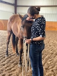 Kentucky National Guard 1st Lt. Sarah Drerup, commander of the 299th Chemical Company, leads a horse during resiliency training at Central Kentucky Riding for Hope inside the Kentucky Horse Park, Lexington, Ky., Aug. 4, 2020.