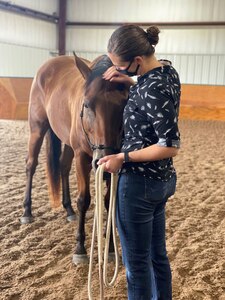 Kentucky National Guard 1st Lt. Sarah Drerup, commander of the 299th Chemical Company, leads a horse during resiliency training at Central Kentucky Riding for Hope inside the Kentucky Horse Park, Lexington, Ky., Aug. 4, 2020.