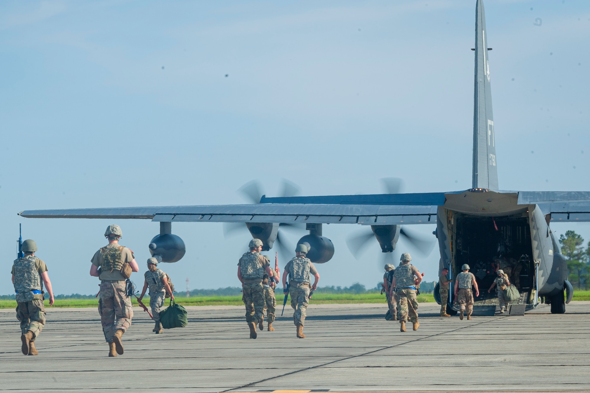 Photo of Airmen unloading a HC-130J Combat King II