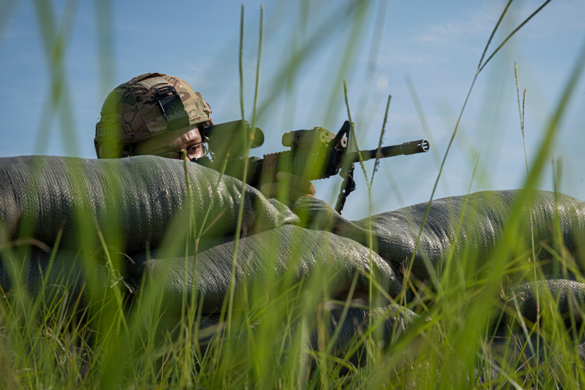 Photo of an Airman manning a defensive fighting position