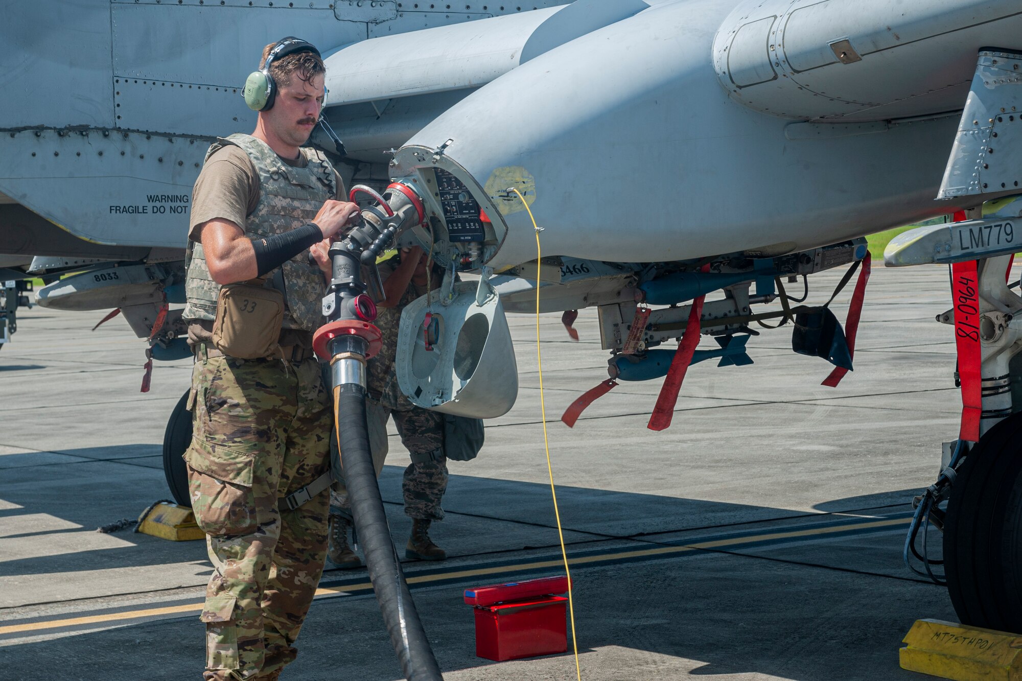 Photo of an Airman refueling an A-10C Thunderbolt II