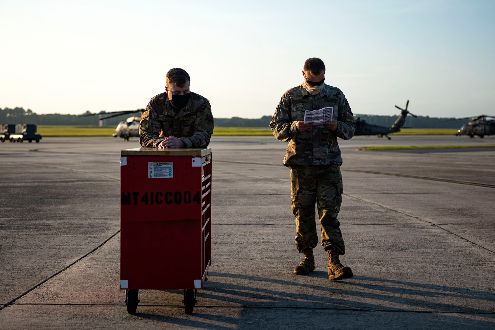 Photo of Airmen walking back to a hangar.