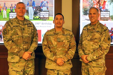 (From left) Army South Command Sgt. Maj. Trevor Walker; Lt. Col. David Esteban Diaz Janampa, partner nation liaison officer, U.S. Army South; and Maj. Gen. Daniel R. Walrath, commanding general, U.S. Army South, commemorate the 199th anniversary of Ejército del Perú, or Army of Peru, Aug. 18 at the Army South main conference room at Joint Base San Antonio-Fort Sam Houston.