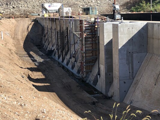 Work continues on improving stability and drainage around the stilling basin walls.  Here, workers construct concrete bases for post-tension anchors which will further secure the walls to the underlying bedrock.  Installation of the 34 anchors is the most technical and time consuming phase of the Stilling Basin Rehabilitation Project at Tuttle Creek Lake.