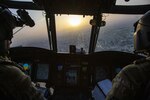 Soldiers pilot a CH-47 Chinook helicopter during a training flight over the city of Erbil in the Kurdistan Region of Iraq, May 23, 2020.
