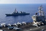 PHILIPPINE SEA (Aug. 18, 2020) Japanese Maritime Self-Defense Force Murasame-class destroyer Ikazuchi (JS 107) steams alongside the Navy's only forward-deployed aircraft carrier USS Ronald Reagan (CVN 76). Ronald Reagan, the flagship of Carrier Strike Group 5, provides a combat-ready force that protects and defends the United States, as well as the collective maritime interests of its allies and partners in the Indo-Pacific region. (U.S. Navy photo by Mass Communication Specialist 3rd Class Jason Tarleton)