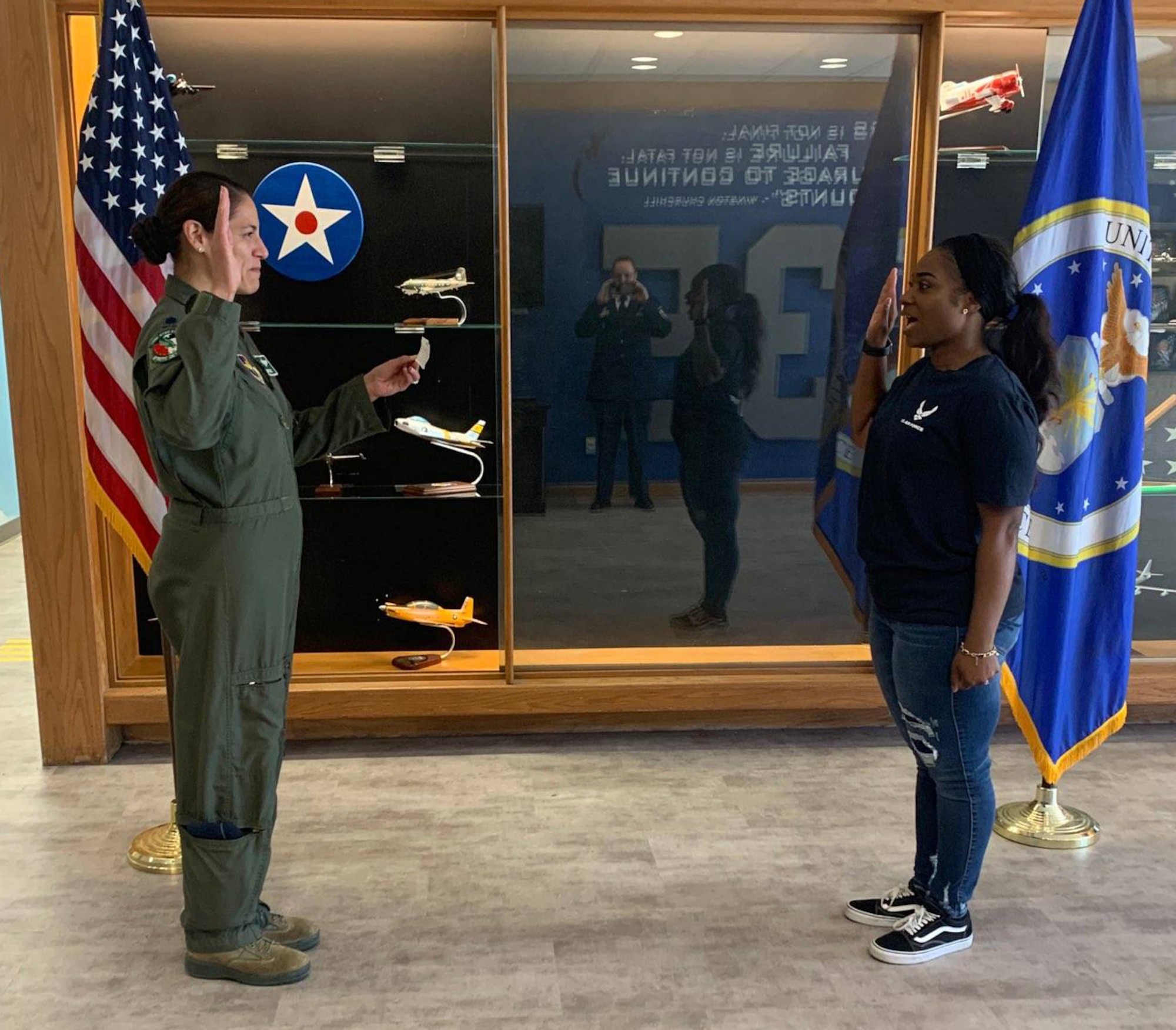 Staff Sgt. Ashley Edwards takes the oath of enlistment from Lt. Col. Sandra Bonney, who at the time was the Air Force ROTC commander at the University of North Texas.