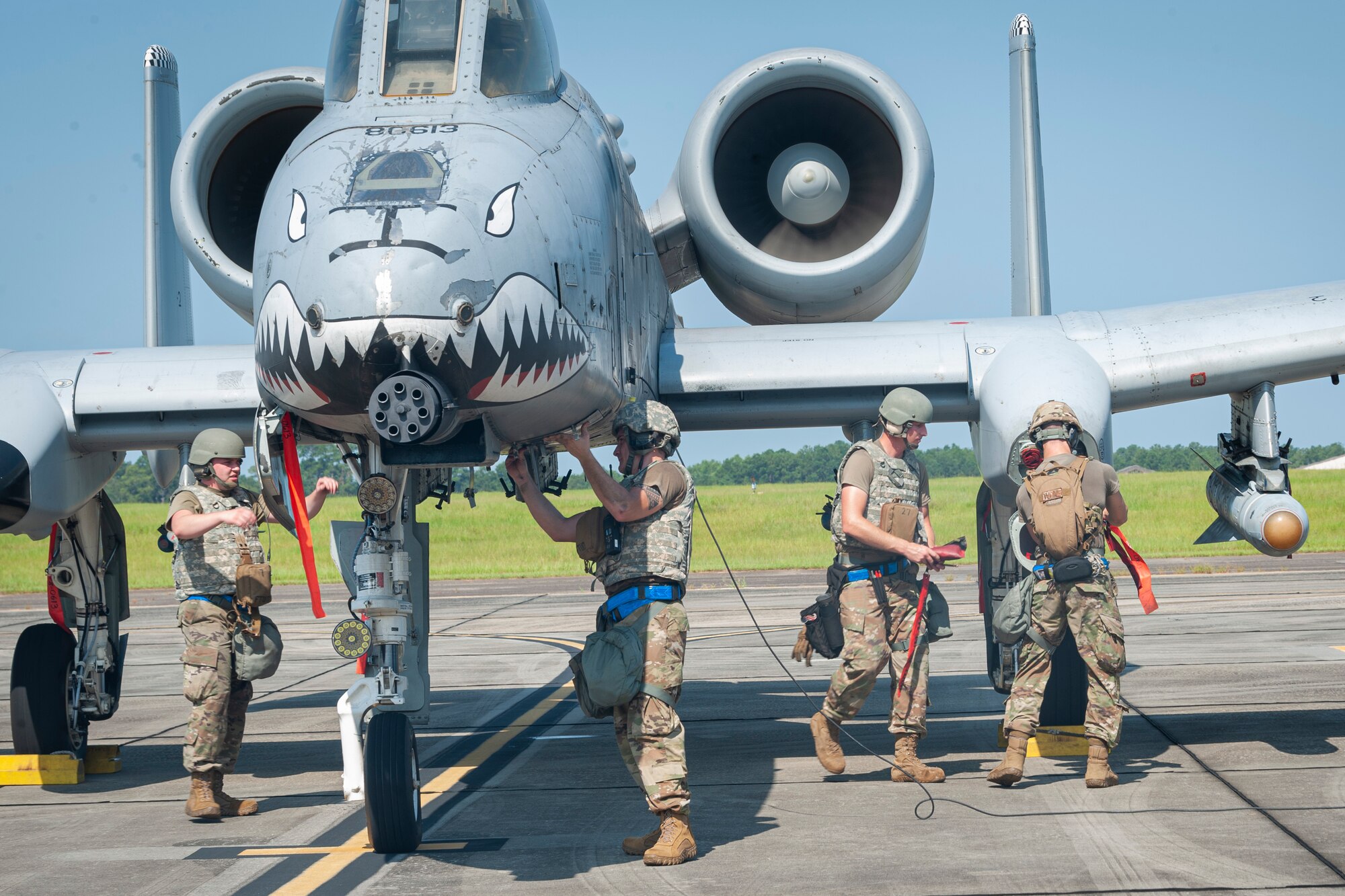 Photo of Airmen preparing an A-10C Thunderbolt II for takeoff