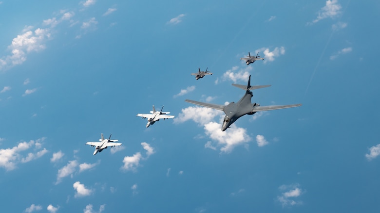 U.S. Navy Carrier Air Wing five F/A-18 Super Hornets, Marine Corps Marine Fighter Attack Squadron 121 F-35 Lightning IIs, all assigned to Marine Corps Air Station Iwakuni, Japan, and a U.S. Air Force 37th Bomb Squadron B-1B Lancer assigned to Ellsworth Air Force Base, S.D., conduct a large-scale joint and bilateral integration training exercise Aug. 18, 2020. Four B-1B Lancers, two B-2 Spirit Stealth Bombers, and four F-15C Eagles conducted Bomber Task Force missions simultaneously within the Indo-Pacific region over the course of 24 hours. Pacific Air Forces routinely conducts BTF operations to show the United States' commitment to allies and partners in the Indo-Pacific area of responsibility. (U.S. Air Force photo by Staff Sgt. Peter Reft)