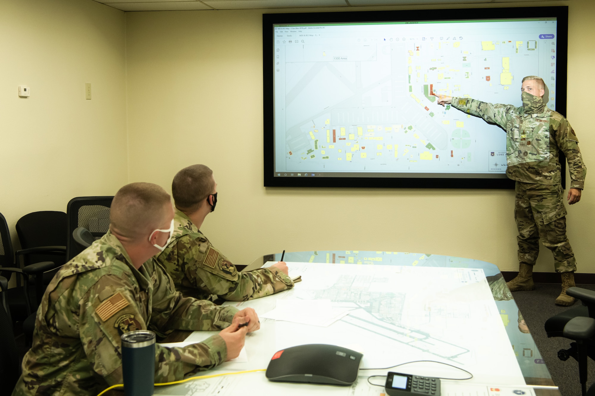 Second Lt. Ben Rieben, 56th Civil Engineer Squadron Operations Element requirements and optimization officer in charge, presents a base map on the current status of infrastructure across the installation Aug. 11, 2020, at Luke Air Force Base, Ariz.