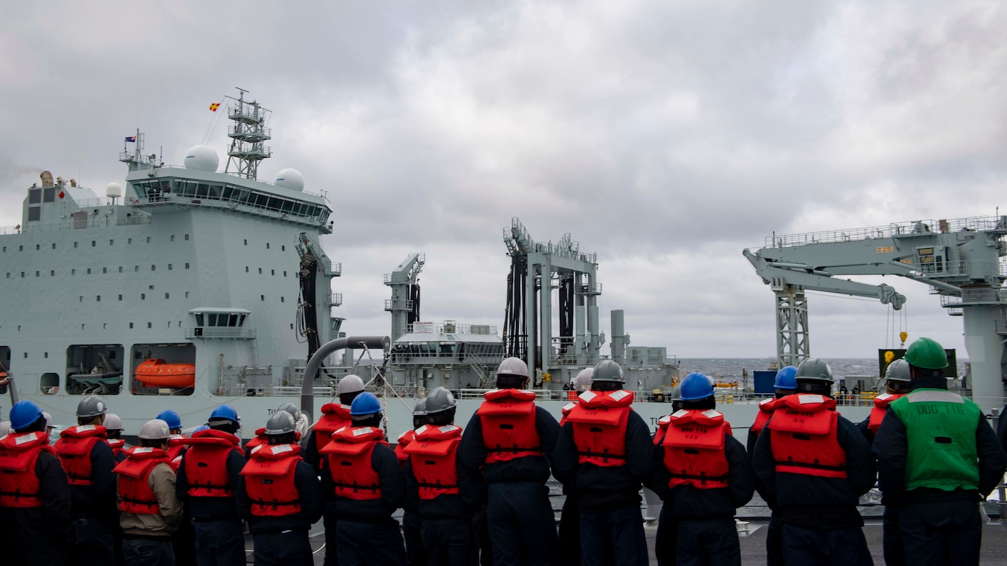 Sailors assigned to the Arleigh Burke-class guided-missile destroyer USS Thomas Hudner (DDG 116) prepare for a replenishment-at-sea with Royal Canadian Navy ship MV Asterix.
