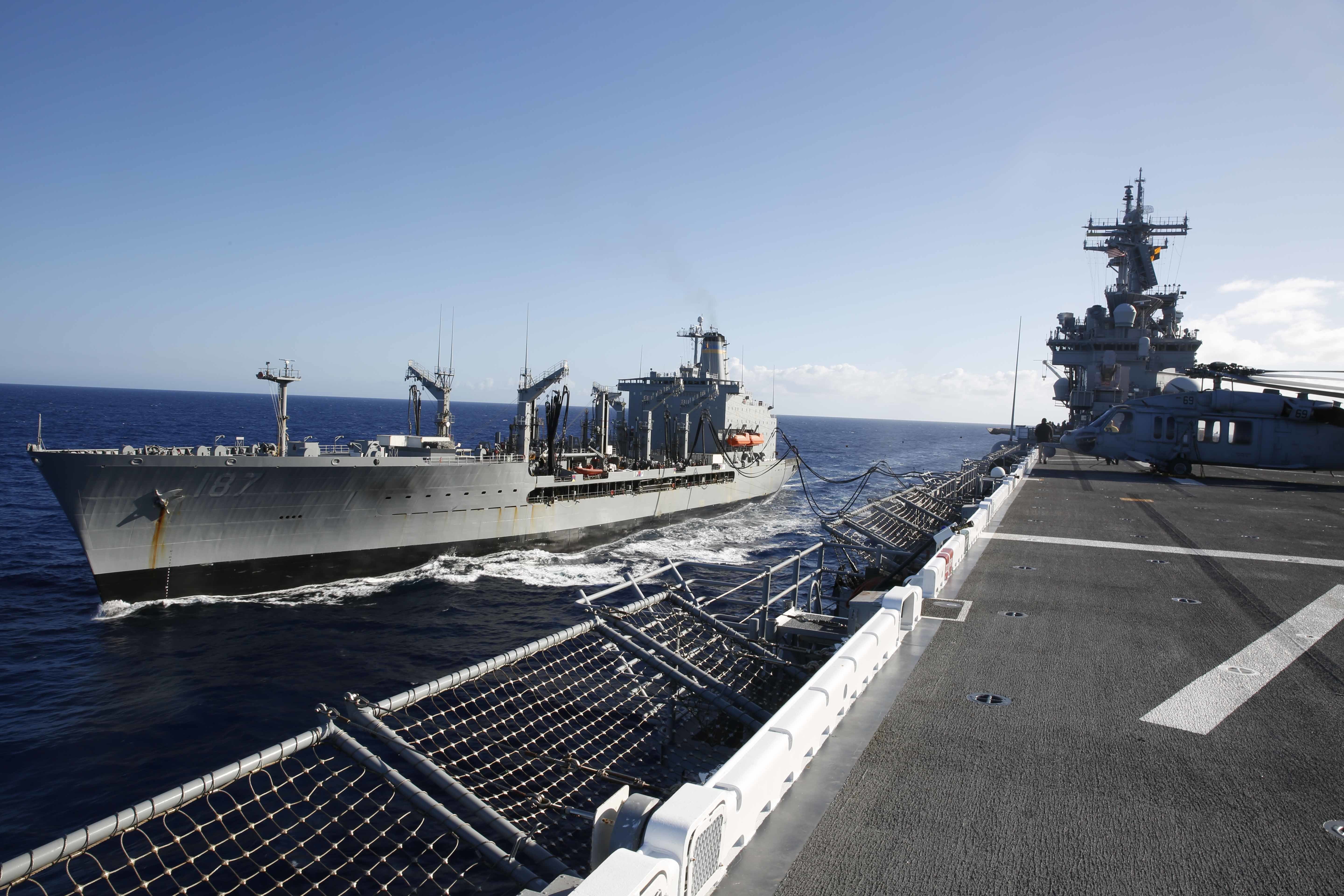 USS Essex (LHD 2) conducts a replenishment-at-sea (RAS) with fleet replenishment oiler USNS Henry J. Kaiser (T-AO 187).