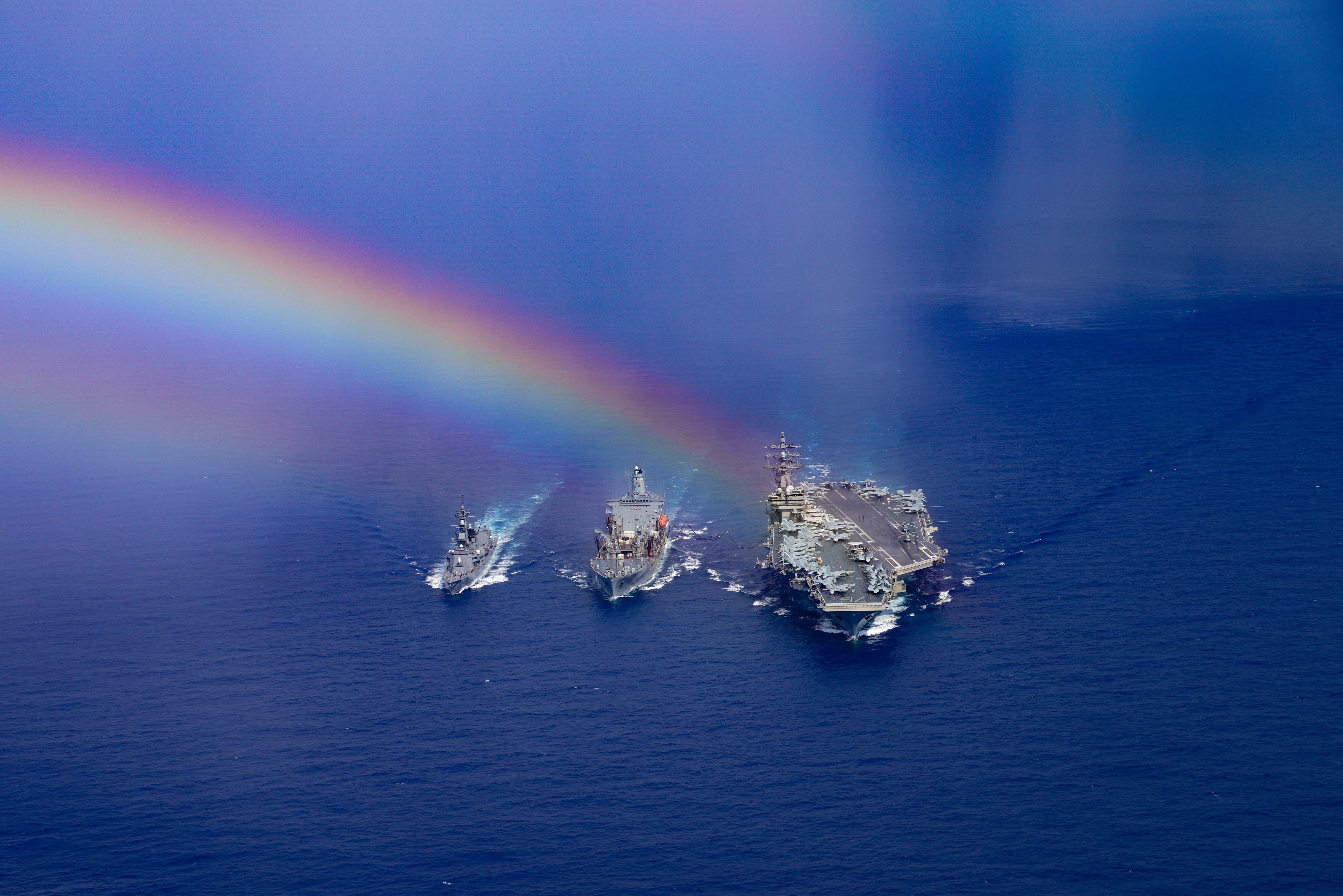 PHILIPPINE SEA (Aug. 16, 2020) (From left) Japanese Maritime Self-Defense Force Murasame-class destroyer Ikazuchi (JS 107), fleet replenishment oiler USNS John Ericsson (T-AO 194) and the Navy’s only forward-deployed aircraft carrier USS Ronald Reagan (CVN 76) steam ahead while conducting a replenishment-at-sea. Ronald Reagan, the flagship of Carrier Strike Group 5, provides a combat-ready force that protects and defends the United States, as well as the collective maritime interests of its allies and partners in the Indo-Pacific region. (U.S. Navy photo by Mass Communication Specialist 3rd Class Jason Tarleton)