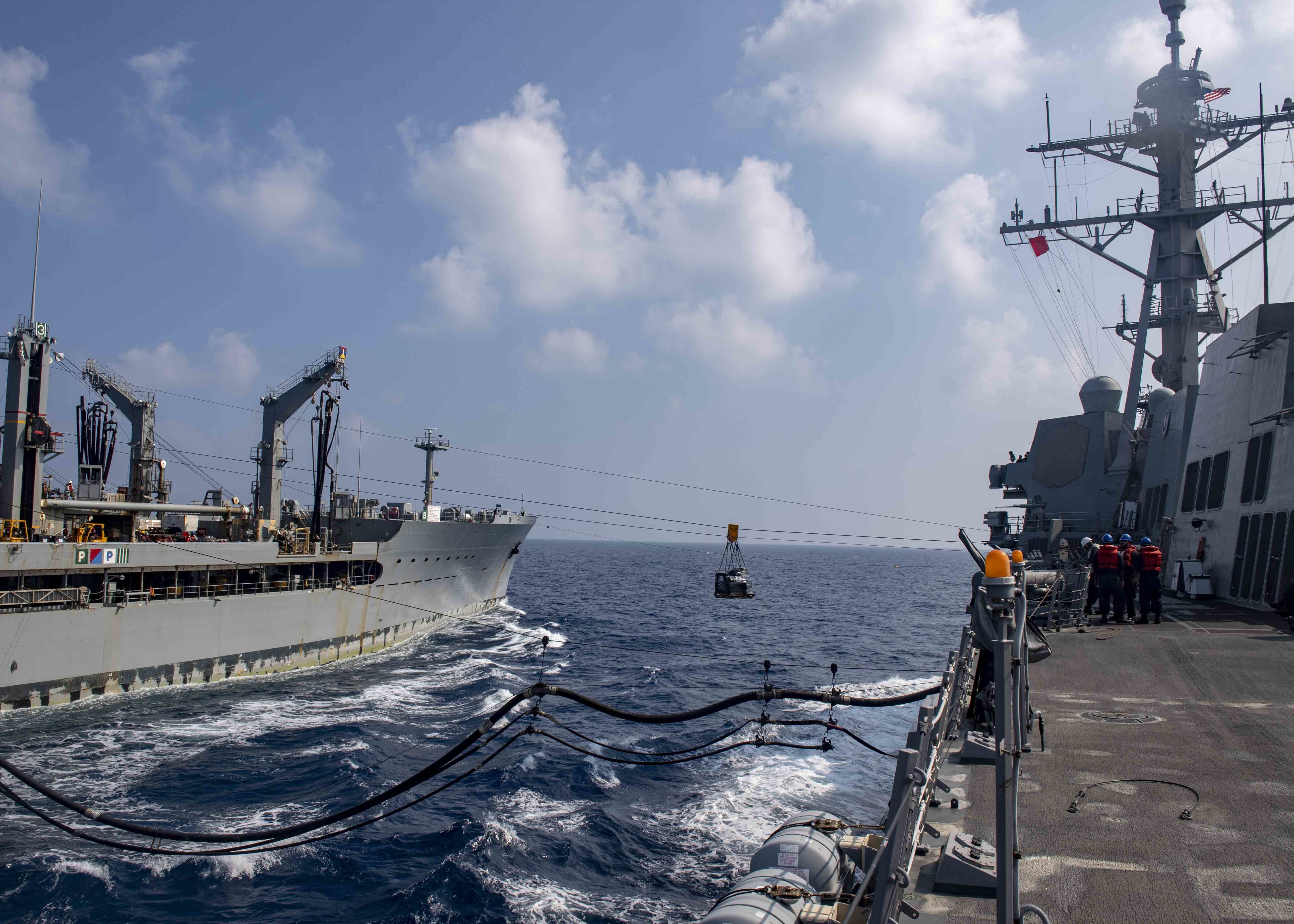 USS Mustin (DDG 89) receives stores and fuel from the USNS John Ericsson (T-AO 194) during a replenishment-at-sea.