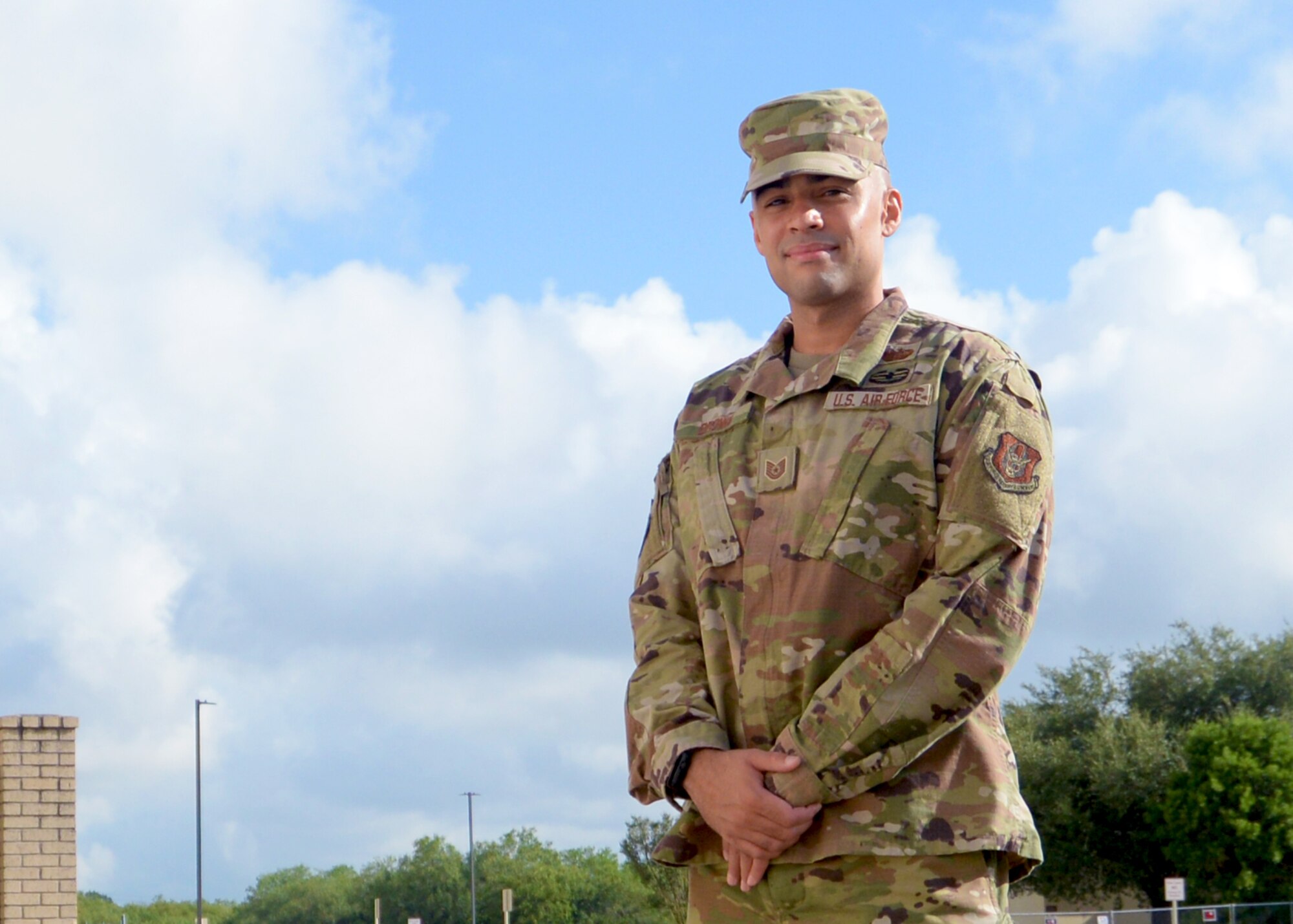 Tech. Sgt. Samuel Brown, 960th Cyberspace Operations Group client systems technician, stands for a photo outside the 960th Cyberspace Wing headquarters building Aug. 8, 2020, at Joint Base San Antonio-Chapman Training Annex, Texas. (U.S. Air Force photo by Samantha Mathison)