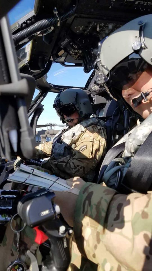 New York Army National Guard aviators Chief Warrant Officer 4 Tom Scott and Chief Warrant Officer 3 Aaron Chiu, assigned to the 3rd Battalion, 142nd Aviation Regiment, prepare to perform a test flight on a UH-60M Black Hawk helicopter at the Sikorsky fielding facility in Lakehurst, N.J., Aug. 18, 2020. The New York National Guard aviation battalion is scheduled to field 20 aircraft fresh from the factory over the coming year with another 10 rounding out the battalion's elements assigned in Maine and Connecticut.