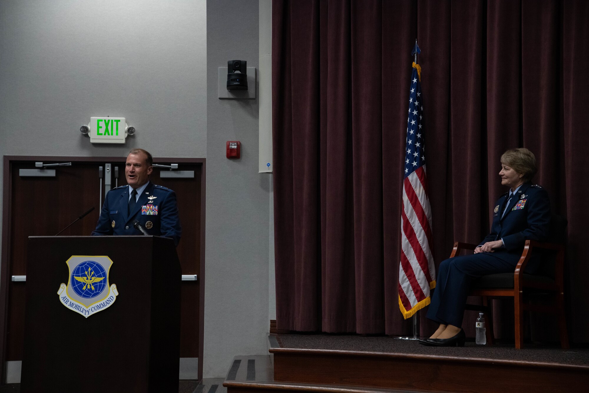 Maj. Gen. Bibb delivers remarks at the podium while Gen. Miller views from the stage.