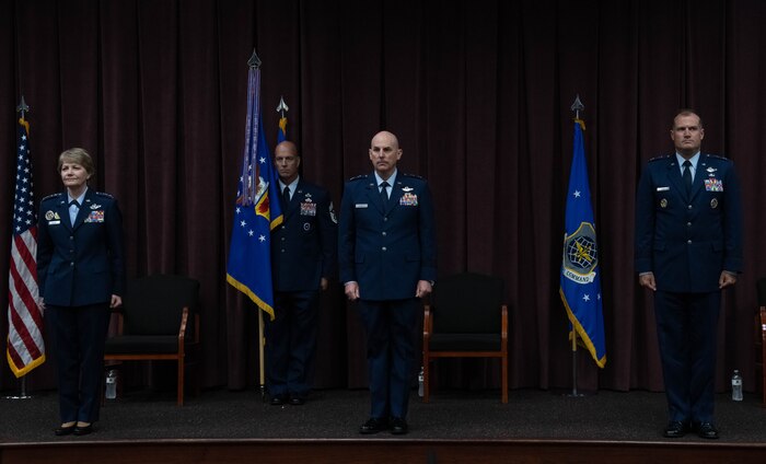 Members of the official party stand at attention during the 18th Air Force Change of Command ceremony at Scott Air Force Base, Ill. Aug. 18, 2020.