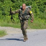 New York Army National Guard Cpl. Troy Perez, a member of the 1st Battalion, 69th Infantry, finishes the 12-mile ruck march during the Army National Guard Northeast Region Best Warrior Competition at Camp Ethan Allen in Jericho, Vermont, Aug. 16, 2020. Perez finished first in the junior enlisted category of the competition. It is the third time in three years a New York Army Guard Soldier has won.