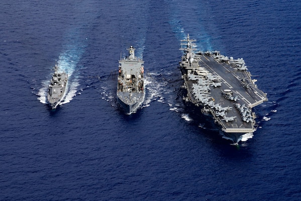 USS Ronald Reagan (CVN 76) is underway with JS Ikazuchi (DD 107) and USNS John Ericsson (T-AO 194).