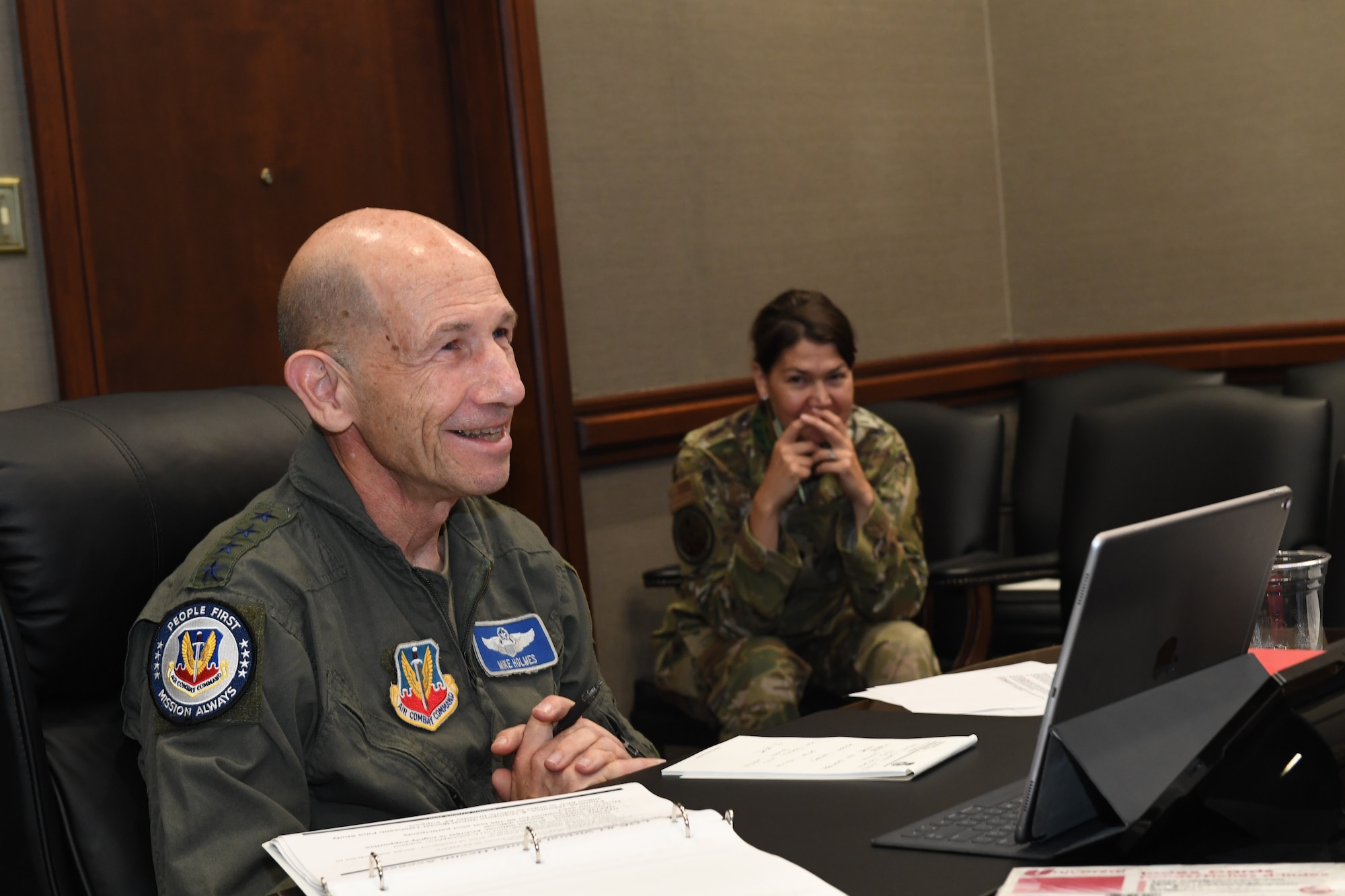 Gen. Mike Holmes, commander of Air Combat Command, smiles as he tells a story from when he was a young squadron commander during an outbrief for Sword Athena 2020 as part of a virtual Zoom call hosted by Air Combat Command Aug. 14, 2020 from Joint Base Langley-Eustis, Virginia. SA20 was a leadership symposium designed to develop rising leaders, across all enlisted and commissioned ranks, to focus on the female- and family-centric issues that impact readiness. (U.S. Air Force photo by Tech. Sgt. Nick Wilson)