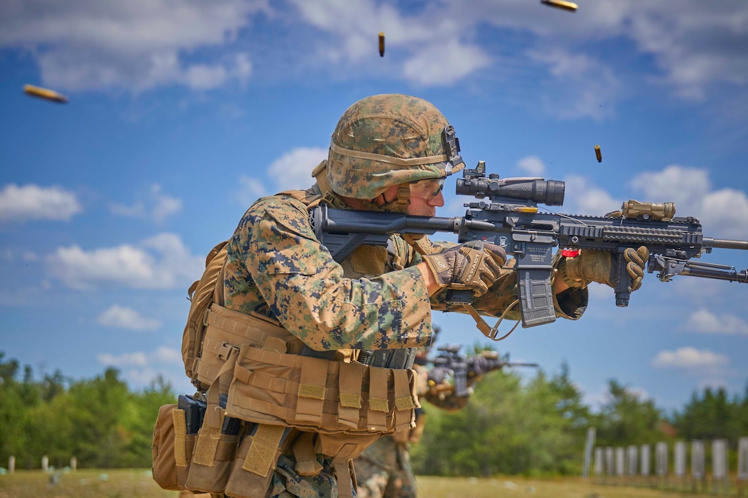 A Marine fires a rifle.