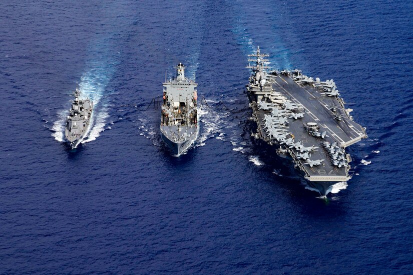 Three ships sail in formation.