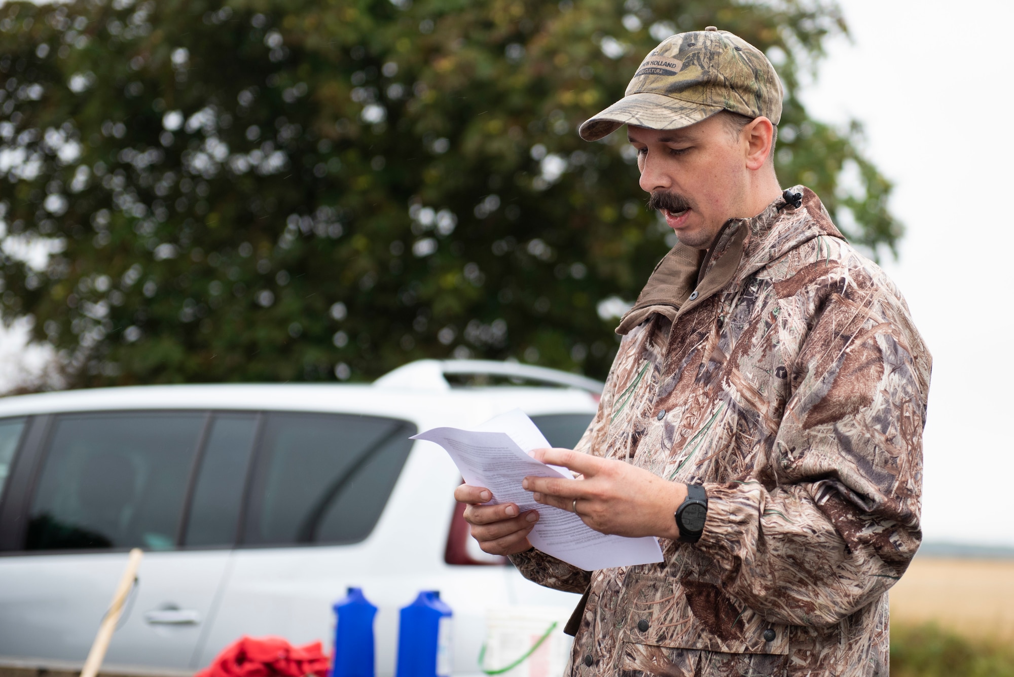 U.S. Air Force Master Sgt. Aaron Beil, U.S. Africa Command Directorate for Intelligence at RAF Molesworth technician, reads the history of the 355th Fighter Group Steeple Morden Memorial in Steeple Morden, England, during Operation TORCH-2020 memorial cleanup August 15, 2020. U.S. Africa Command Directorate for Intelligence at RAF Molesworth partnered with the American Battle Monuments Commission to host Operation TORCH-2020, where over 50 military members and their families, U.K. nationals and Boy Scout Troop #245, cleaned six WWII memorial sites to preserve American service member legacies and promote an appreciation of past American heroes among present-day USAFRICOM workforce and families. (U.S. Air Force Photo by Airman 1st Class Jennifer Zima)