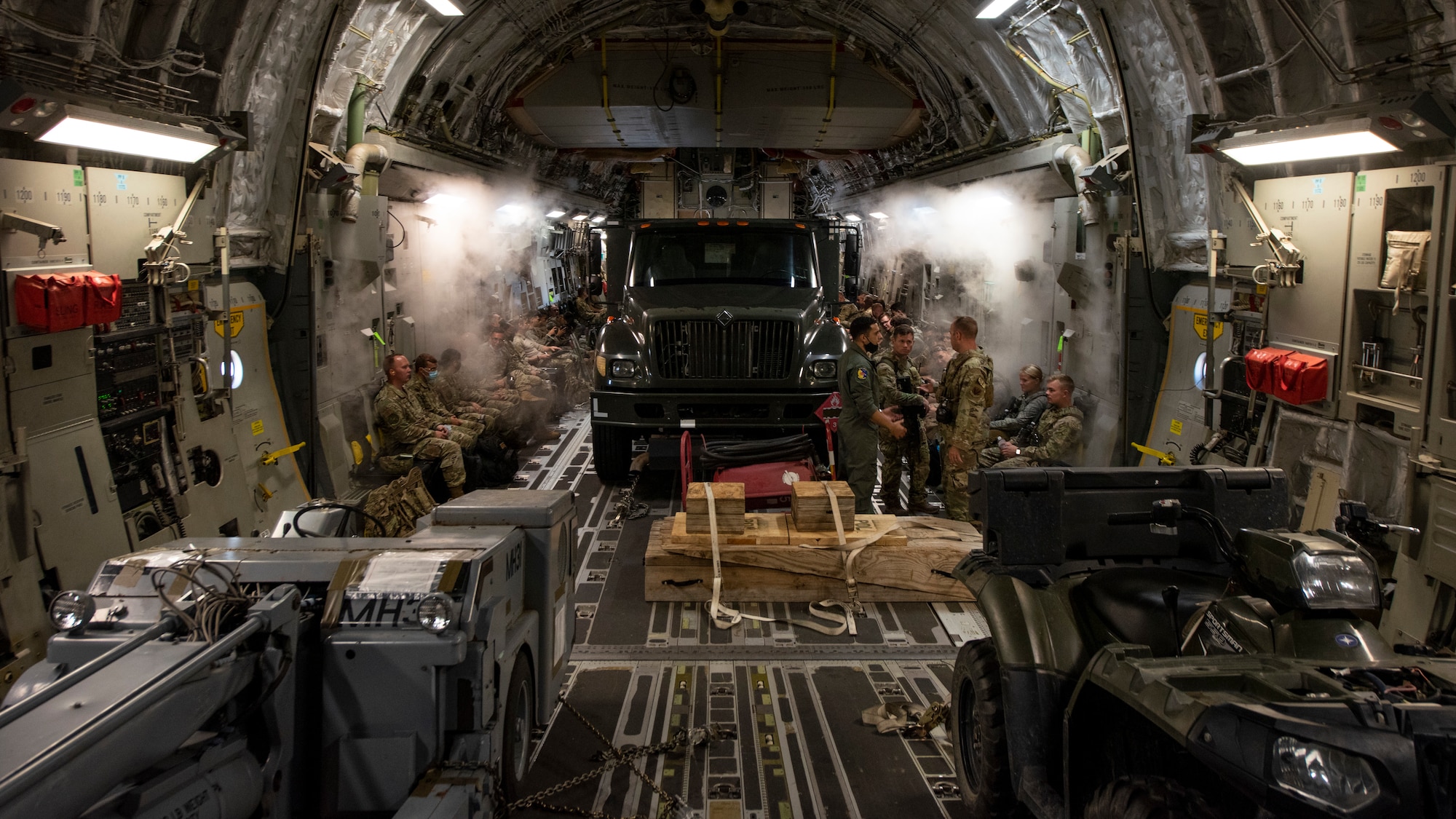 Service members board a C-17 Globemaster III at Seymour Johnson Air Force Base, North Carolina, Aug. 12, 2020.