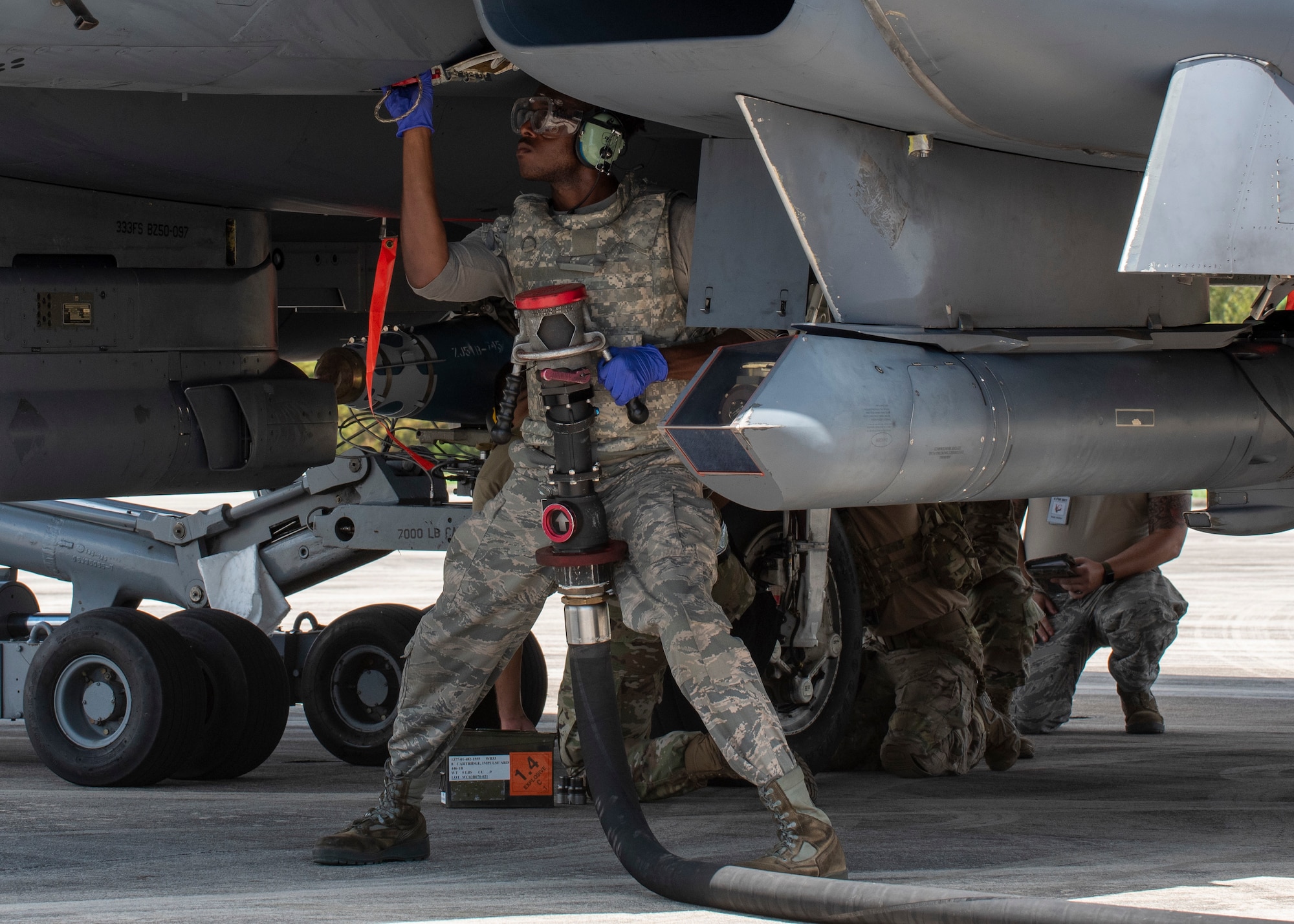 An Airman assigned to Seymour Johnson Air Force Base hot-pit refuels an F-15E Strike Eagle during Razor Talon at Cherry Point Marine Corp Air Station, North Carolina, Aug.12, 2020.