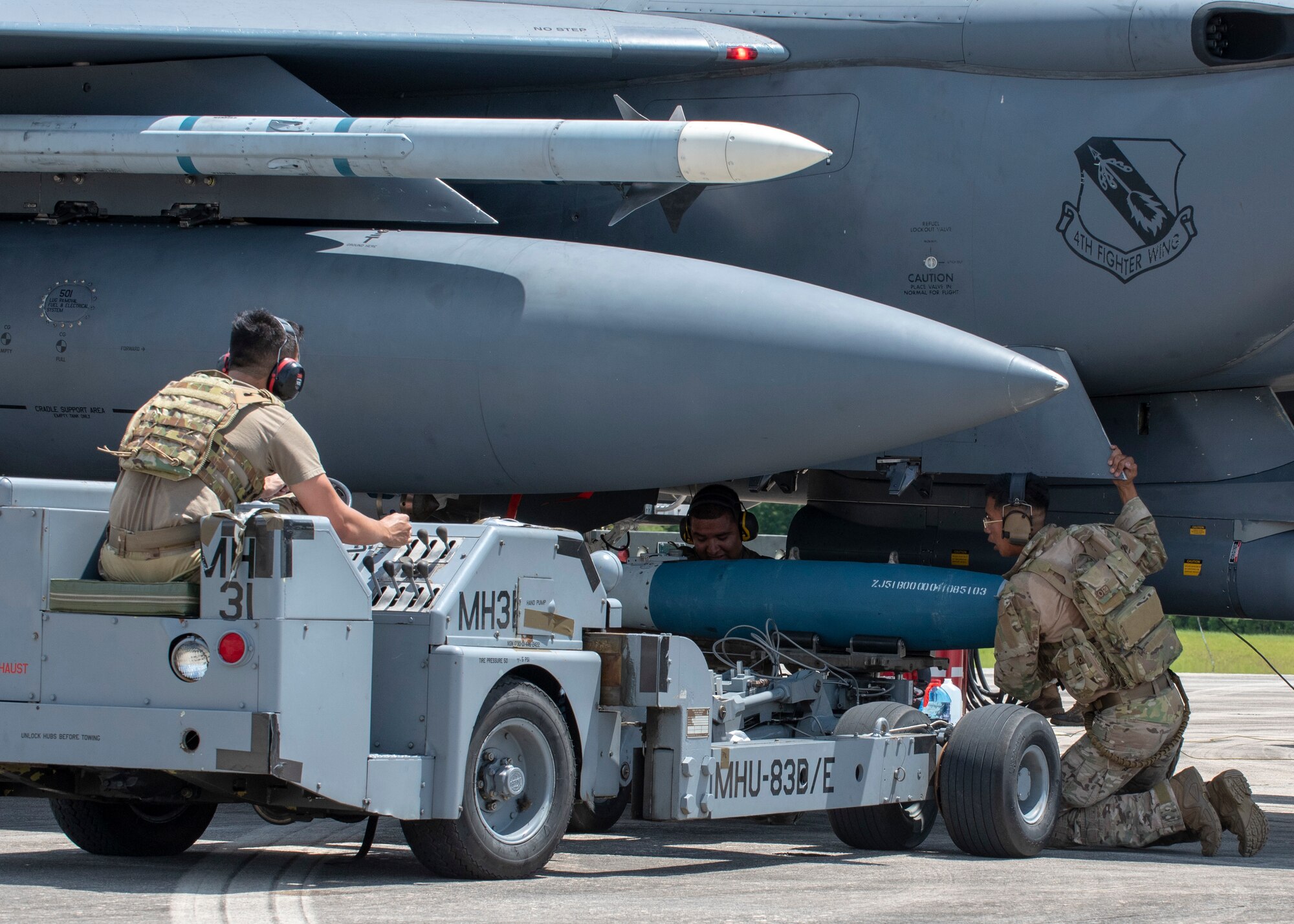 Airmen from Seymour Johnson Air Force Base load munitions onto an F-15E Strike Eagle during Razor Talon at Cherry Point Marine Corp Air Station, North Carolina, Aug.12, 2020.