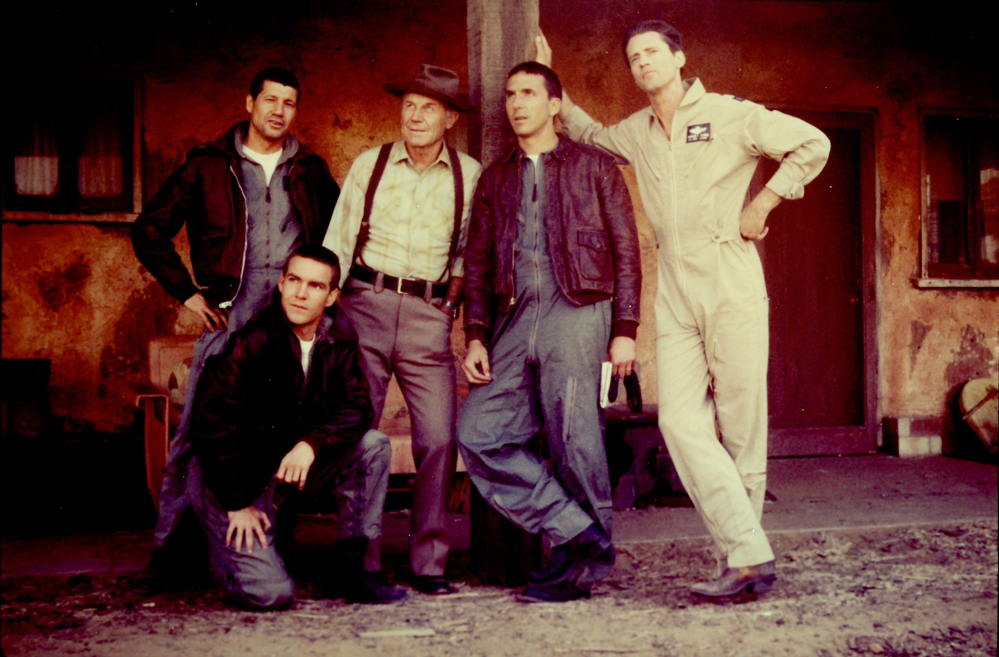 Brig. Gen. (retired) Chuck Yeager poses for a photo with the cast of the film "The Right Stuff" at Edwards Air Force Base in 1982. Yeager played the bartender "Fred" during a cameo appearance in the film. (Photo courtesy of Air Force Test Center History Office)