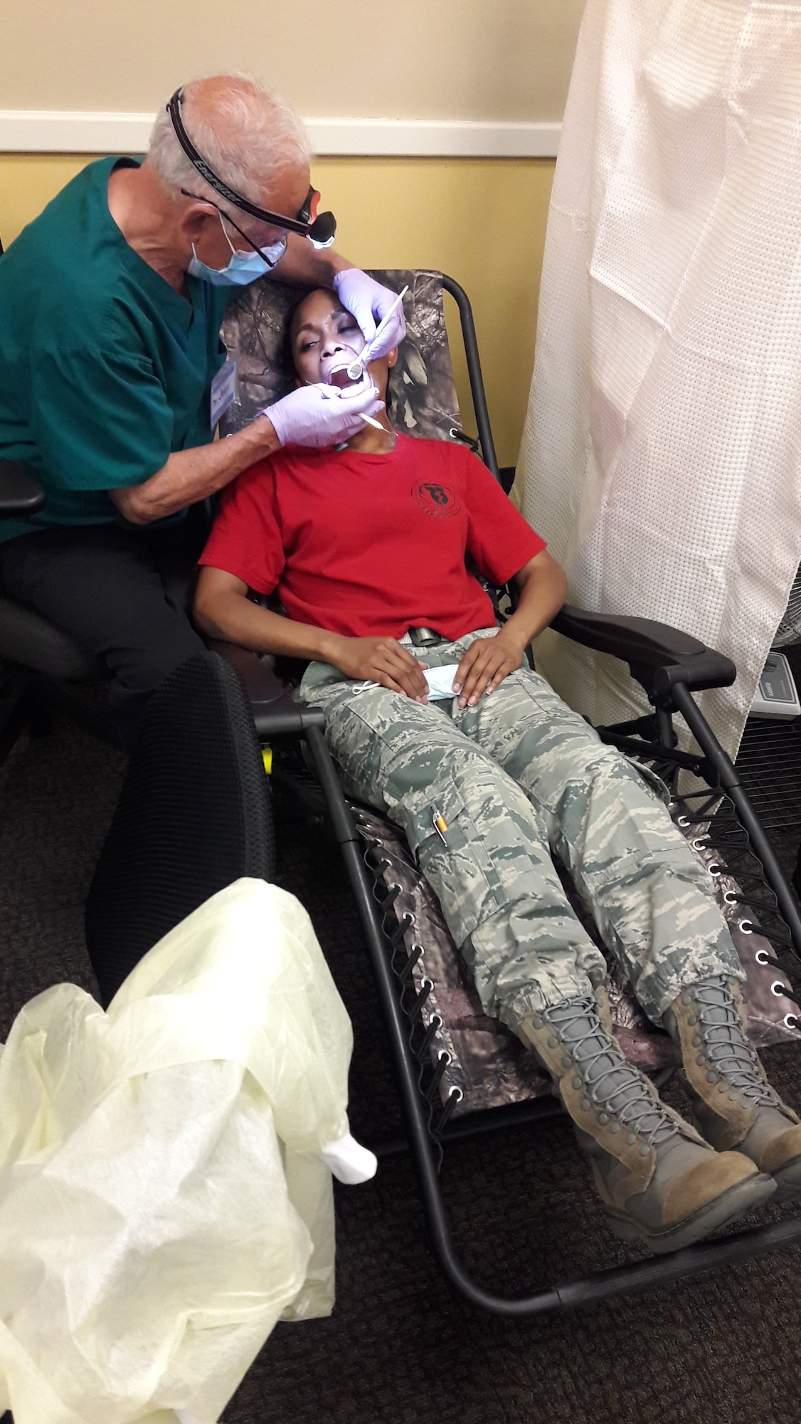 SMSgt. Eleanor Torres, 940th AMDS/SGO receives a dental check up during the August UTA weekend.
